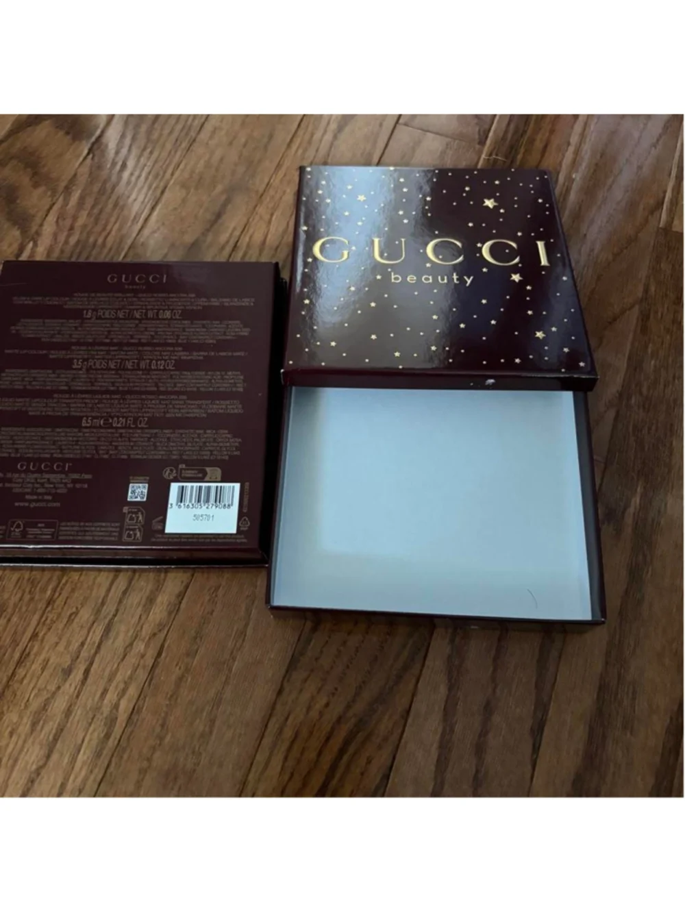 Gucci Beauty makeup boxes with gold stars on a dark background Set of 2 empty Gu